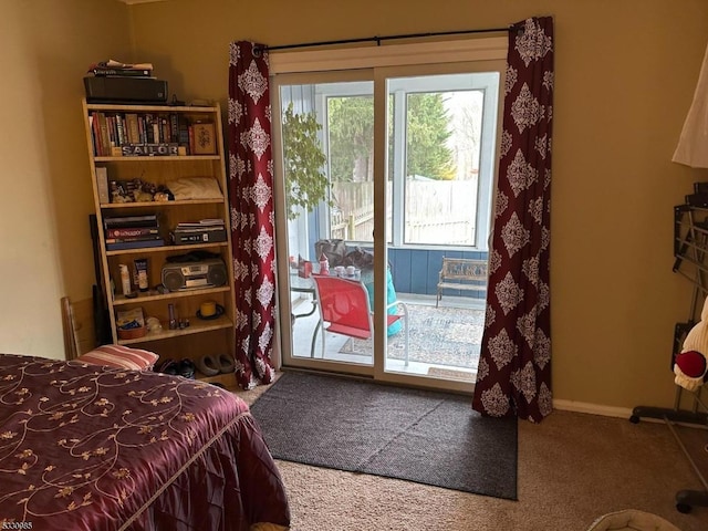 carpeted bedroom featuring access to exterior