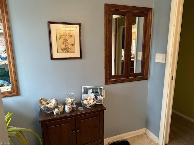 hallway with light colored carpet