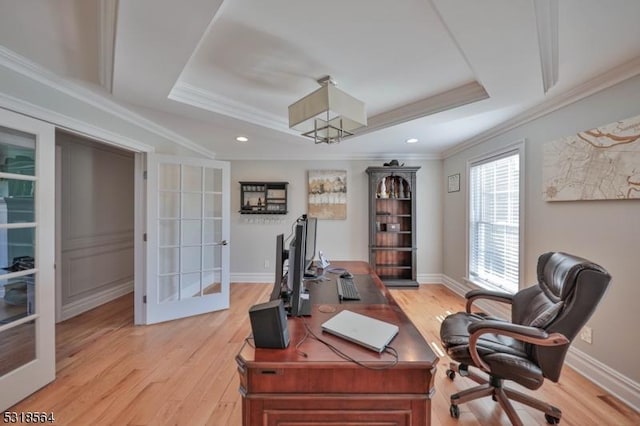 office featuring crown molding, a tray ceiling, and french doors