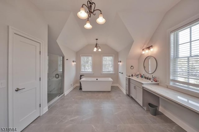 bathroom featuring a chandelier, vanity, lofted ceiling, and plus walk in shower