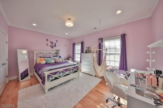 bedroom featuring light hardwood / wood-style floors and ornamental molding