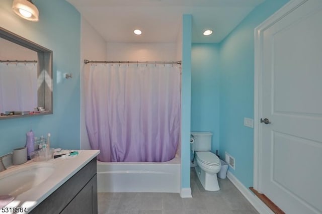 full bathroom featuring shower / bath combination with curtain, vanity, and toilet