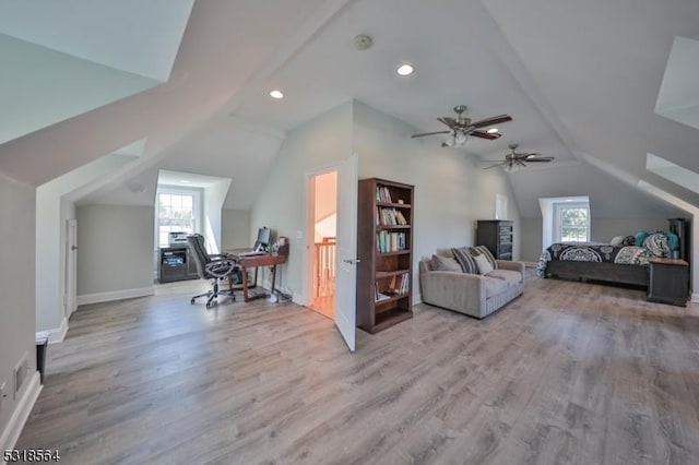 office with ceiling fan, light wood-type flooring, and vaulted ceiling