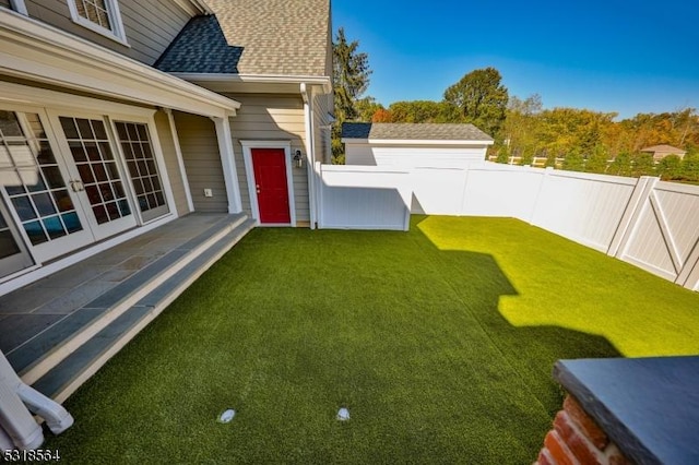 view of yard with french doors