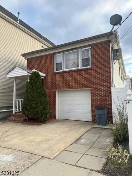 view of side of property with a garage