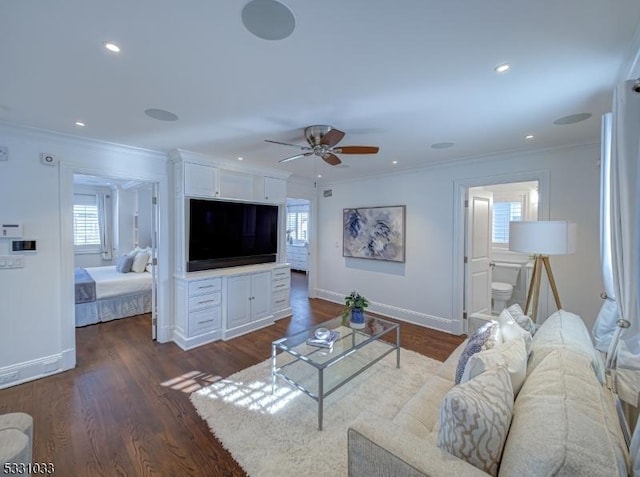 living room featuring ceiling fan, dark hardwood / wood-style floors, and ornamental molding