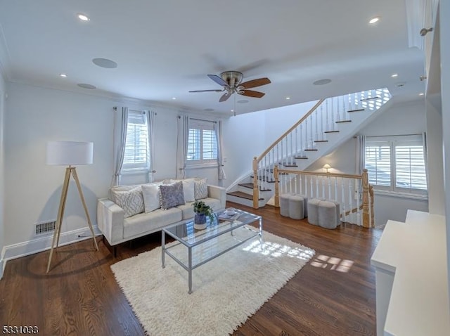 living room featuring ceiling fan, dark hardwood / wood-style flooring, and ornamental molding