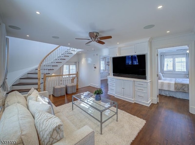 living room with crown molding, dark hardwood / wood-style flooring, a healthy amount of sunlight, and ceiling fan