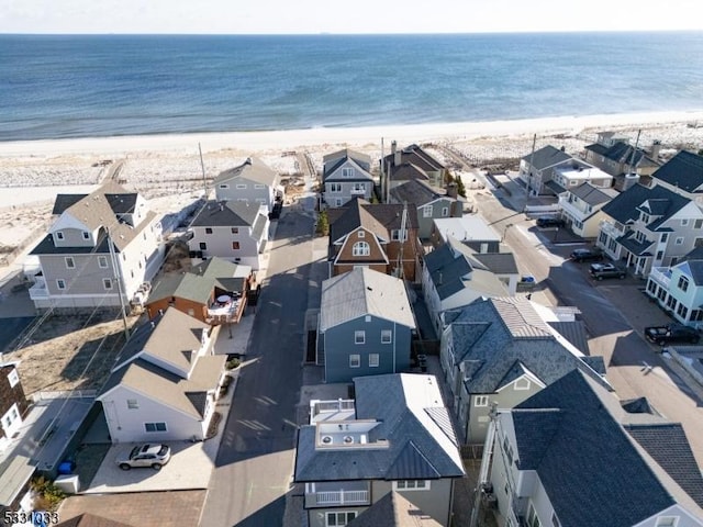 aerial view with a view of the beach and a water view