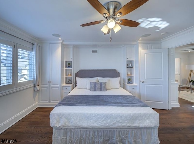 bedroom featuring ceiling fan, dark hardwood / wood-style flooring, and crown molding