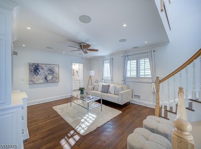 living room with ceiling fan, dark hardwood / wood-style floors, and crown molding