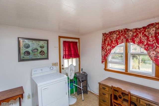 washroom featuring washer / clothes dryer and a healthy amount of sunlight