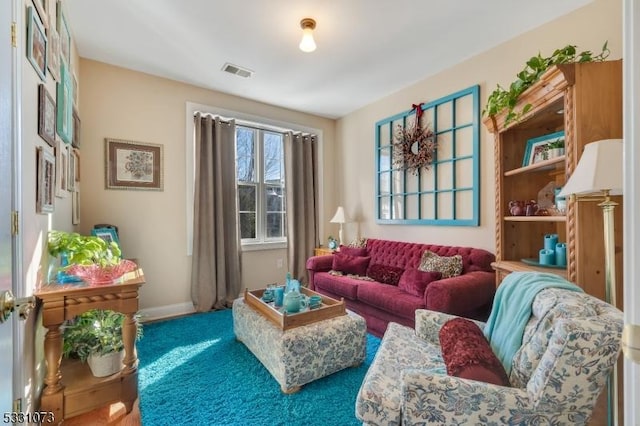 sitting room featuring carpet floors