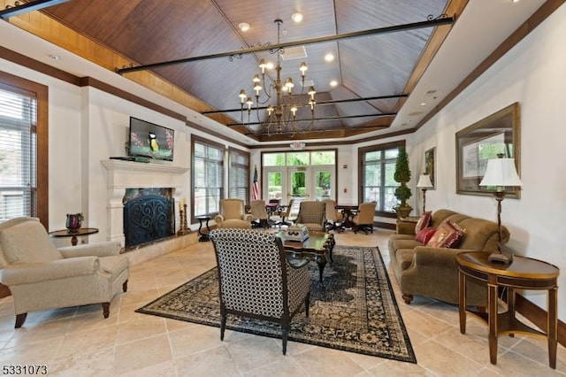 living room featuring a notable chandelier, wood ceiling, and a fireplace