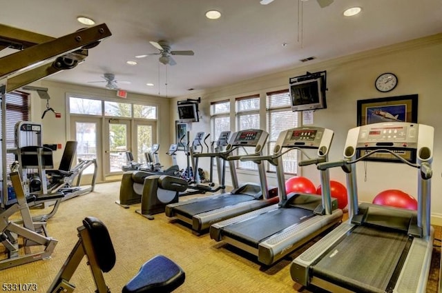 gym featuring french doors, light colored carpet, ceiling fan, and ornamental molding