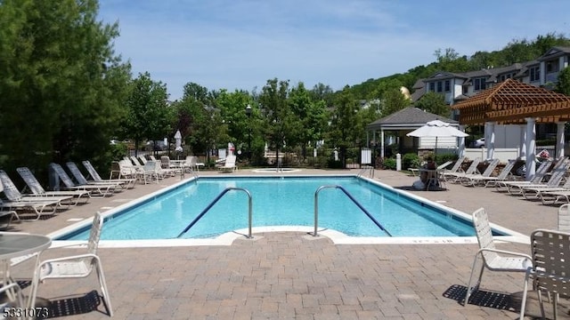 view of swimming pool with a patio area