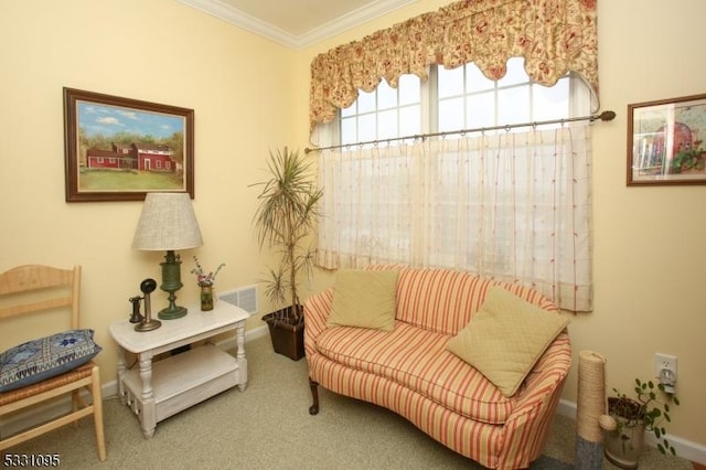 living area with carpet floors and crown molding