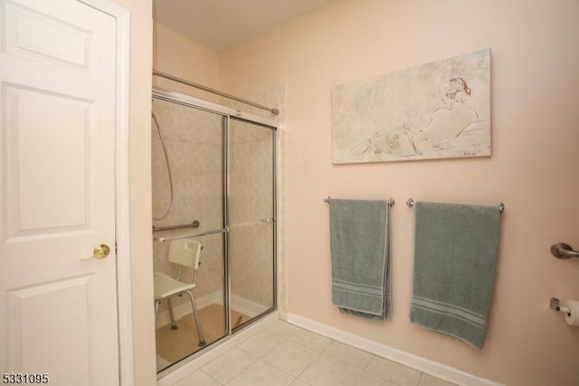 bathroom with a shower with shower door