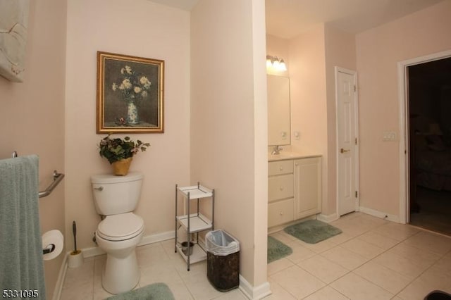 bathroom with tile patterned floors, vanity, and toilet