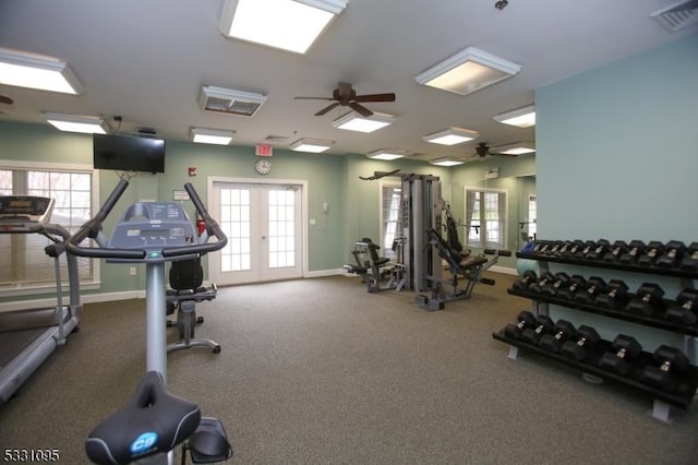 workout area featuring ceiling fan and french doors