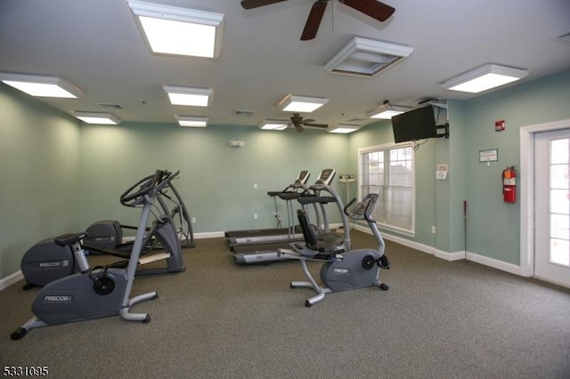 workout area with ceiling fan and a healthy amount of sunlight