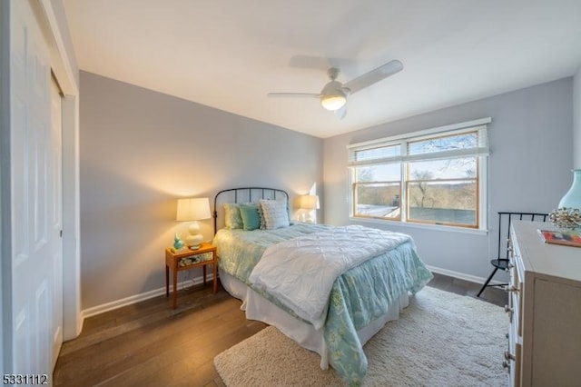 bedroom with ceiling fan, a closet, and dark hardwood / wood-style floors