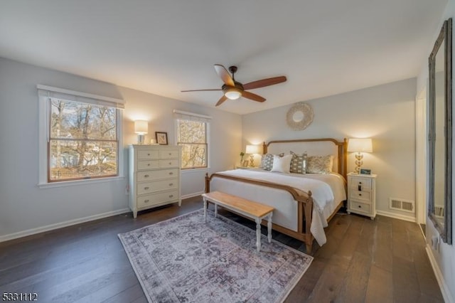 bedroom featuring ceiling fan and dark wood-type flooring