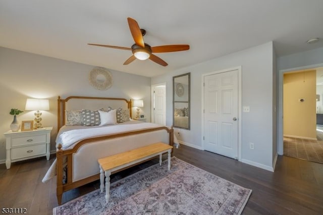 bedroom with dark hardwood / wood-style flooring and ceiling fan