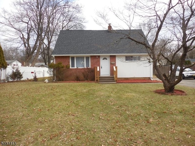 view of front of house with a front lawn