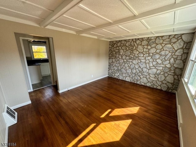 spare room featuring dark hardwood / wood-style floors