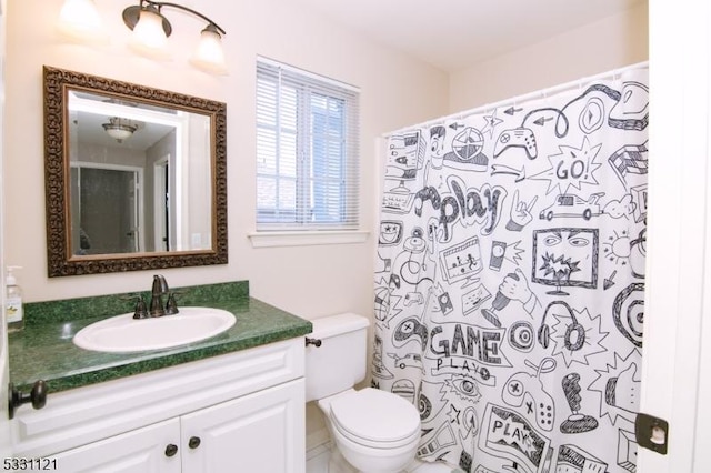 bathroom featuring vanity and toilet