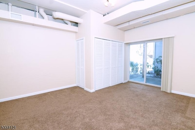 unfurnished bedroom with carpet