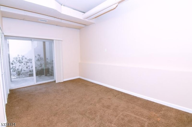 empty room with carpet flooring