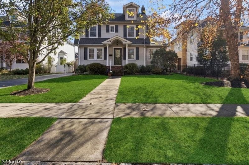 colonial home with a front yard