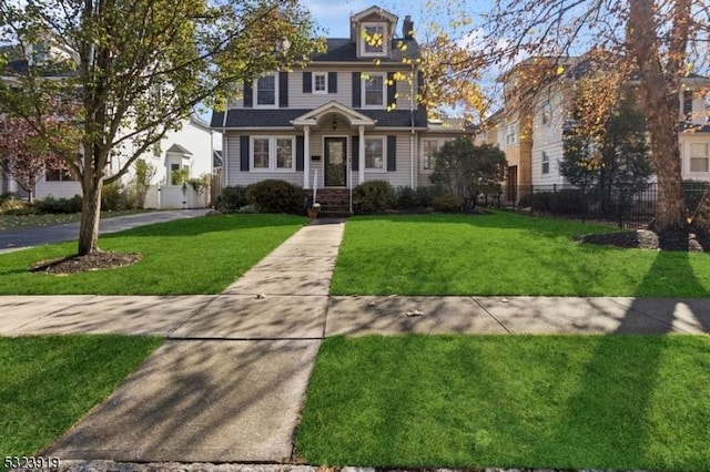 colonial home with a front yard