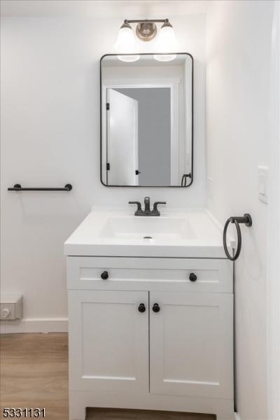 bathroom with wood-type flooring and vanity