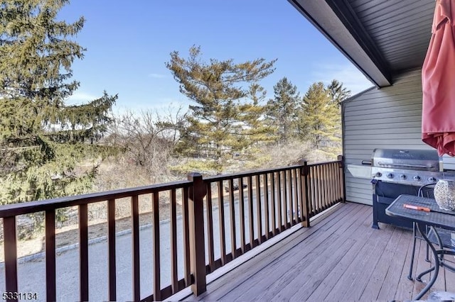 wooden deck featuring area for grilling