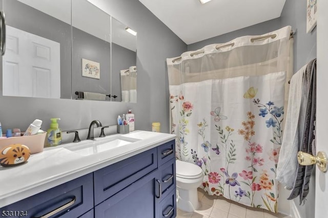 full bath featuring tile patterned flooring, a shower with curtain, vanity, and toilet