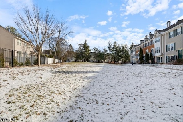 view of yard layered in snow