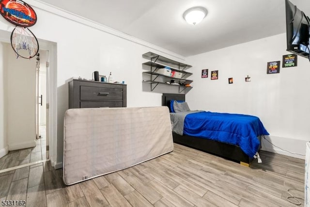 bedroom featuring crown molding