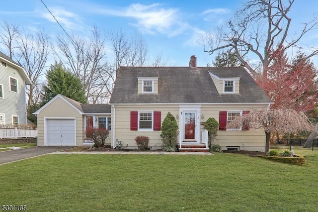 new england style home featuring a chimney, aphalt driveway, an attached garage, fence, and a front yard