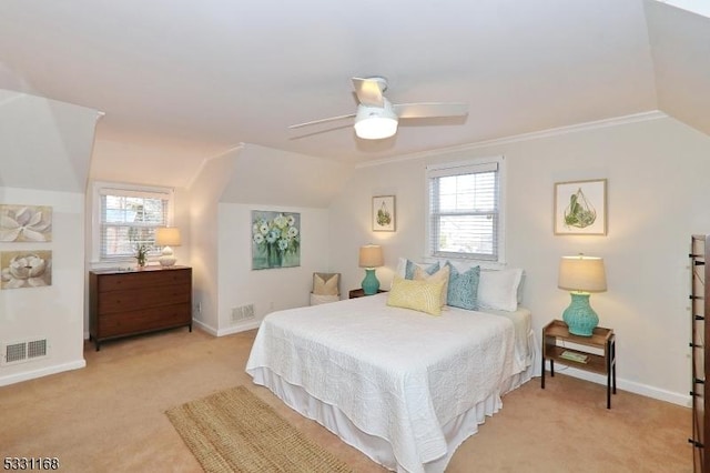 bedroom with light colored carpet, visible vents, vaulted ceiling, and baseboards