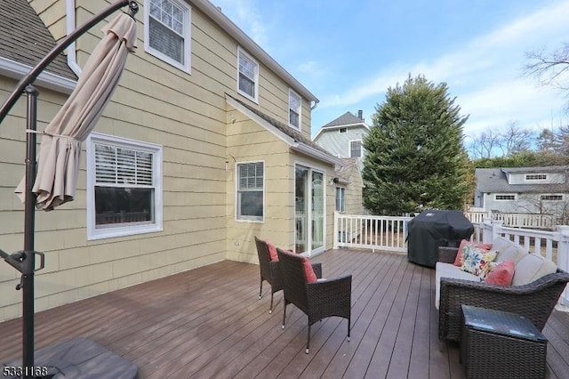 wooden terrace featuring area for grilling