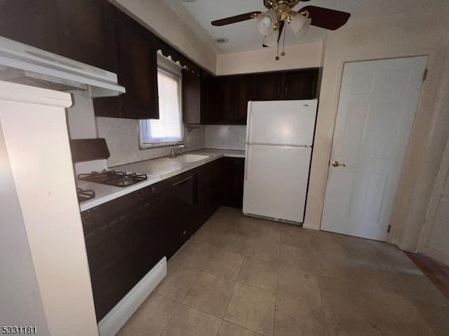 kitchen with tasteful backsplash, white appliances, ceiling fan, sink, and light tile patterned flooring