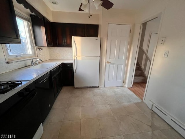 kitchen with ceiling fan, sink, white refrigerator, a baseboard radiator, and dishwasher