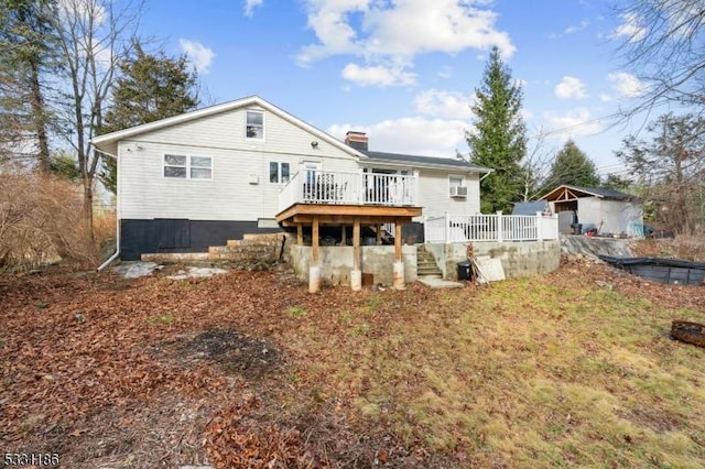 rear view of property with a wooden deck