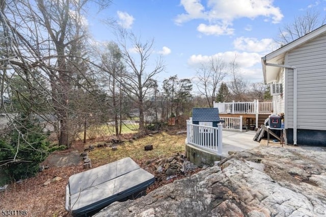 view of yard featuring a wooden deck