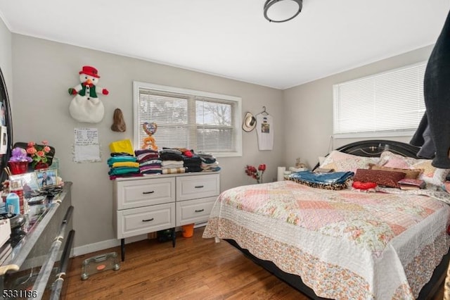 bedroom with wood-type flooring