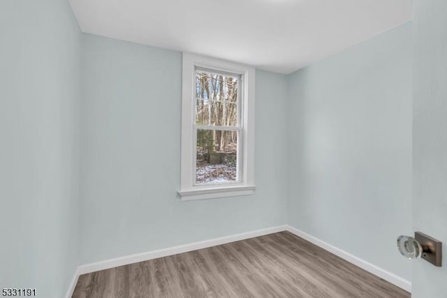 empty room with wood-type flooring