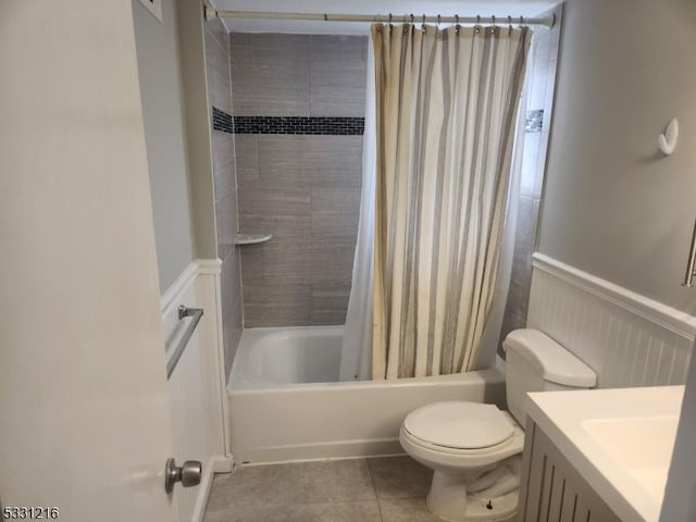 full bathroom with tile patterned flooring, vanity, toilet, and shower / tub combo with curtain